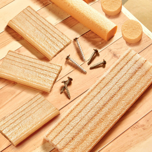 Foam wood and screws on a wooden surface