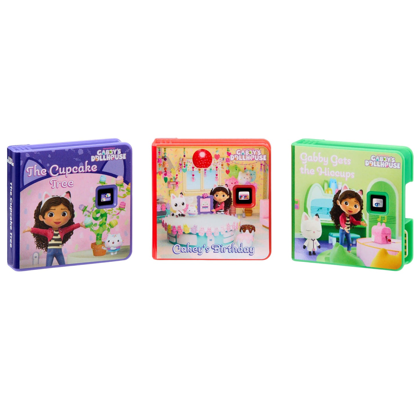 Three small boxed children's books from Gabby's Dollhouse: 'The Cupcake Tree' in purple, 'Cakey's Birthday' in pink, and 'Gabby Gets the Hiccups' in green, shown on a plain white background.