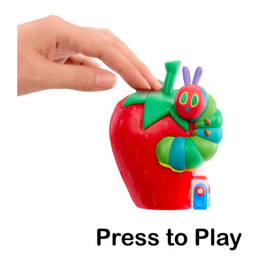 Toy strawberry with a caterpillar and a hand pressing a button labeled 'Press to Play' on a white background.