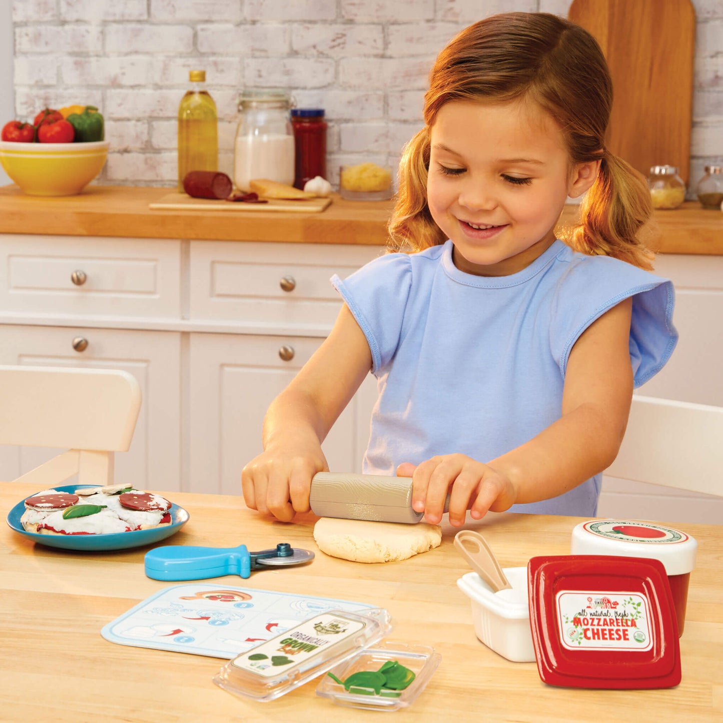 Girl rolling out the dough