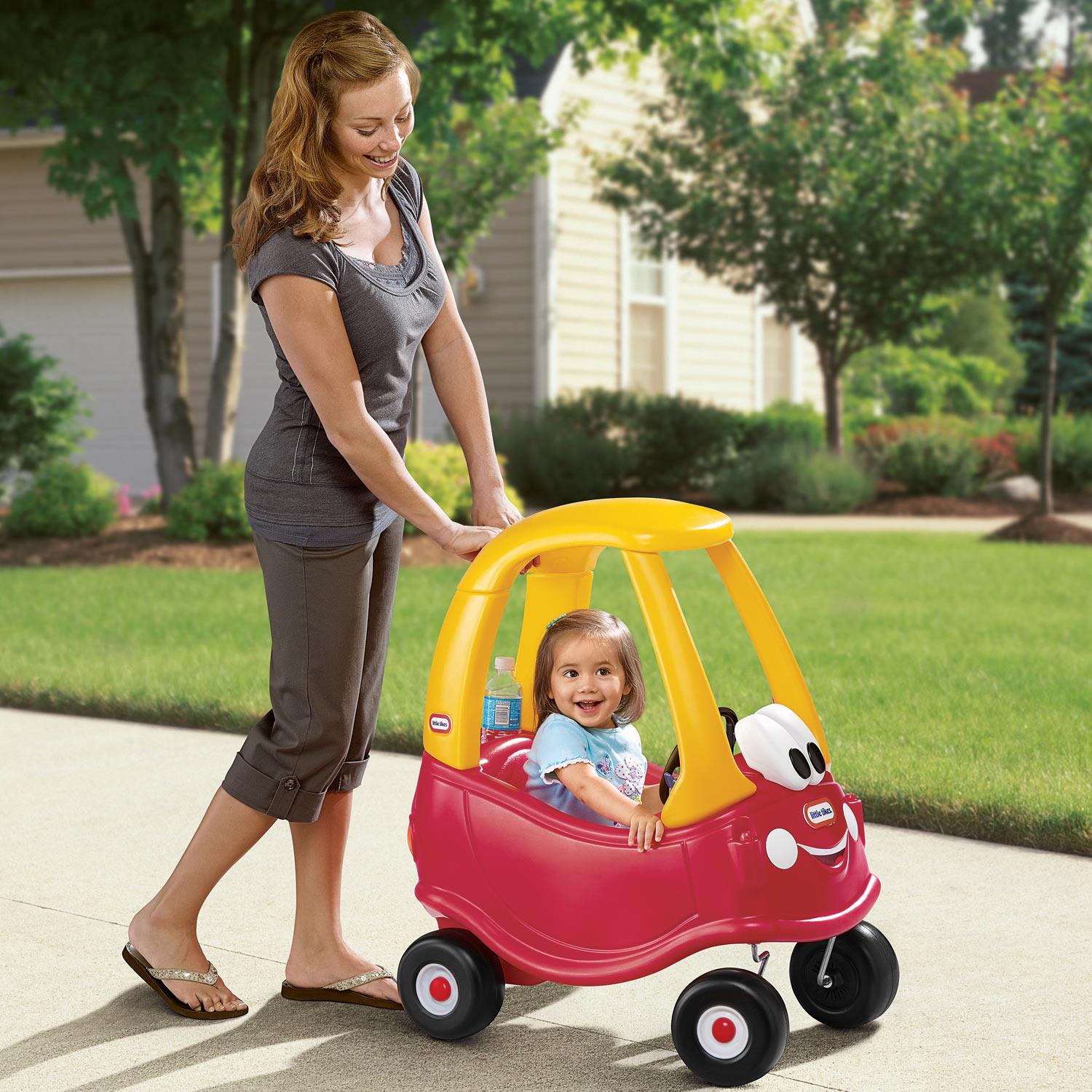 Parent pushing the coupe