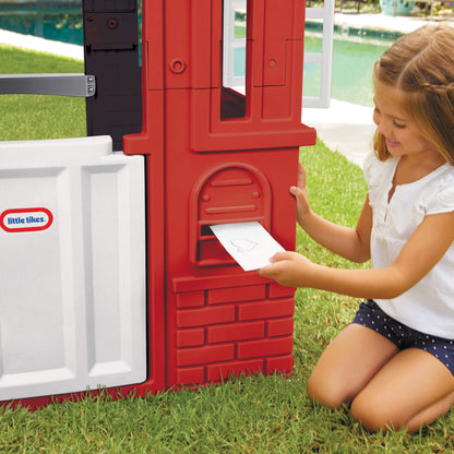 Girl putting mail in mail slot
