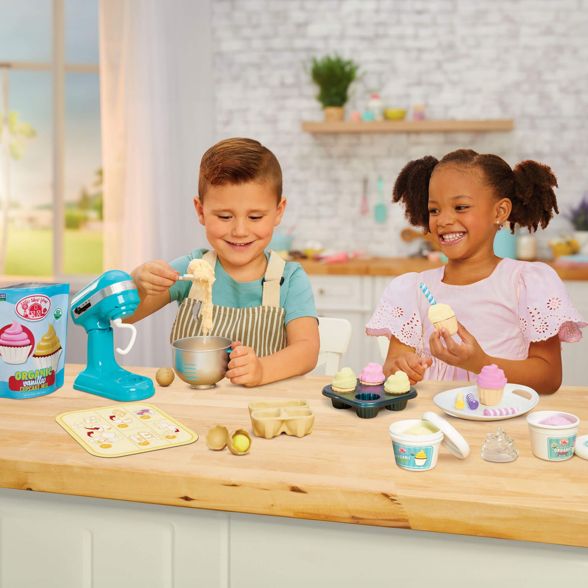 boy and girl making cupcakes