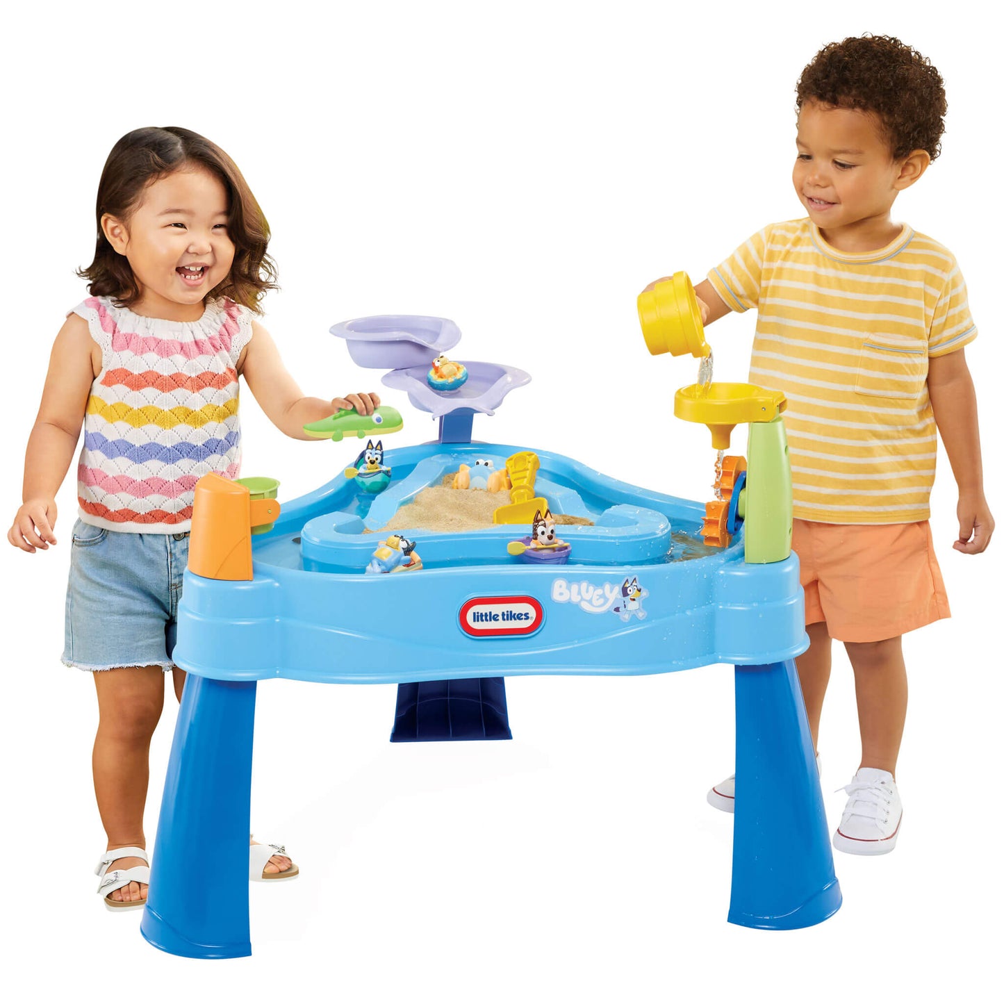Boy and girl playing with water table