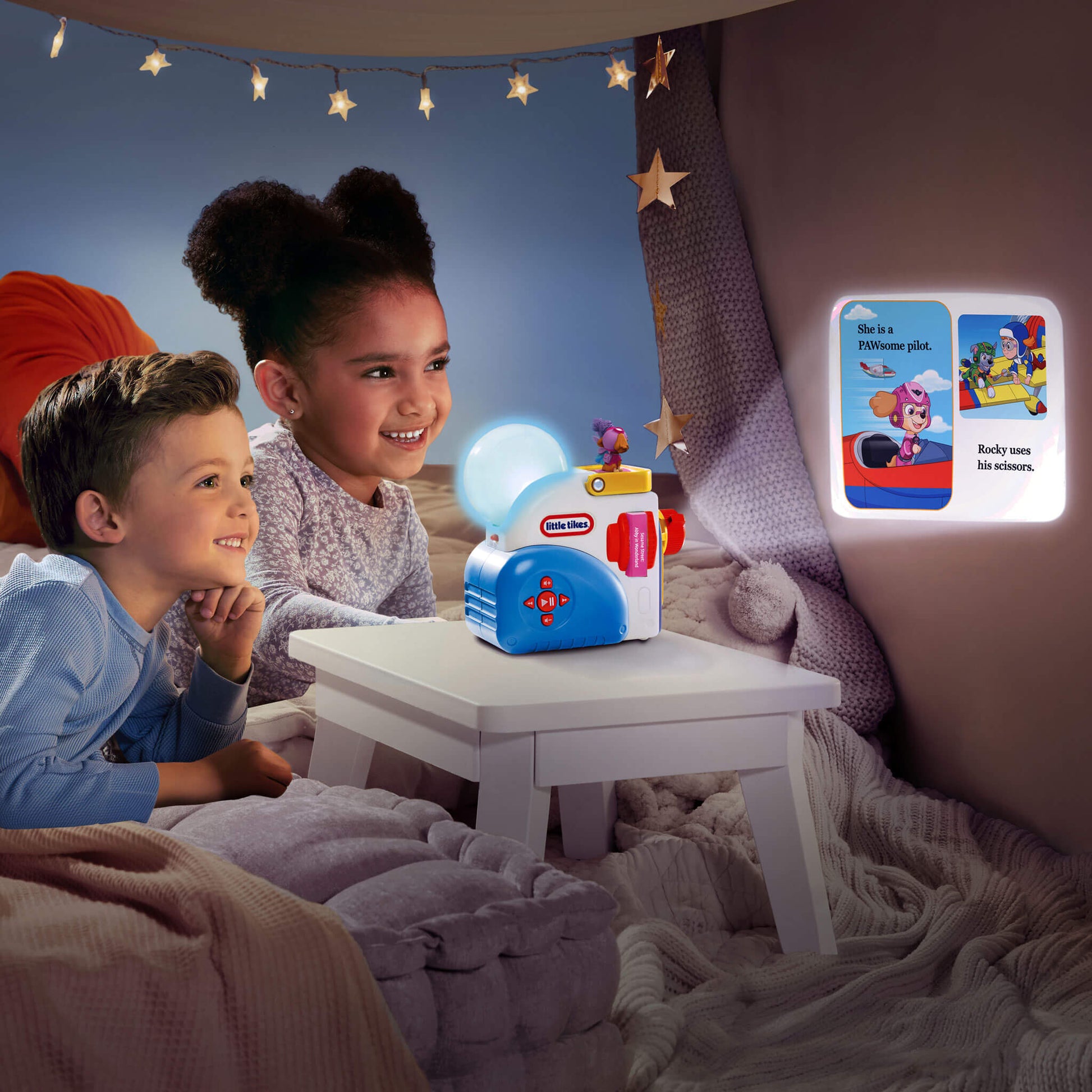 Children sitting in a cozy room with a Little Tikes toy and night light.