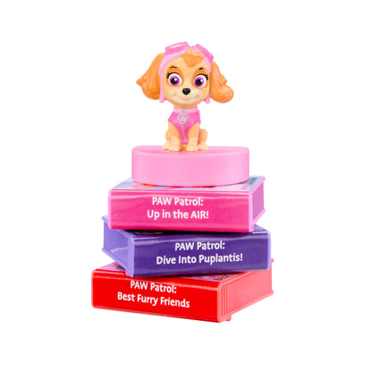 Paw Patrol toy figure on top of colorful books with text on a white background