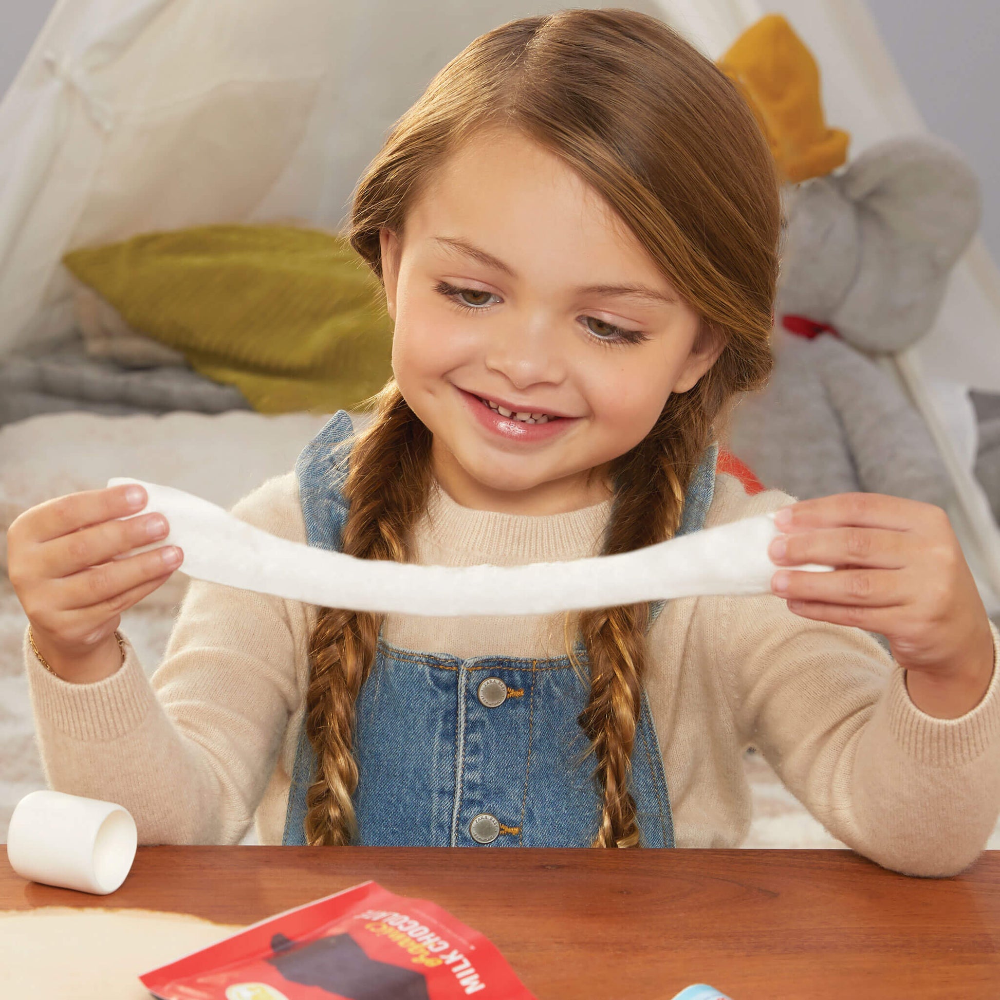 Girl stretching dough