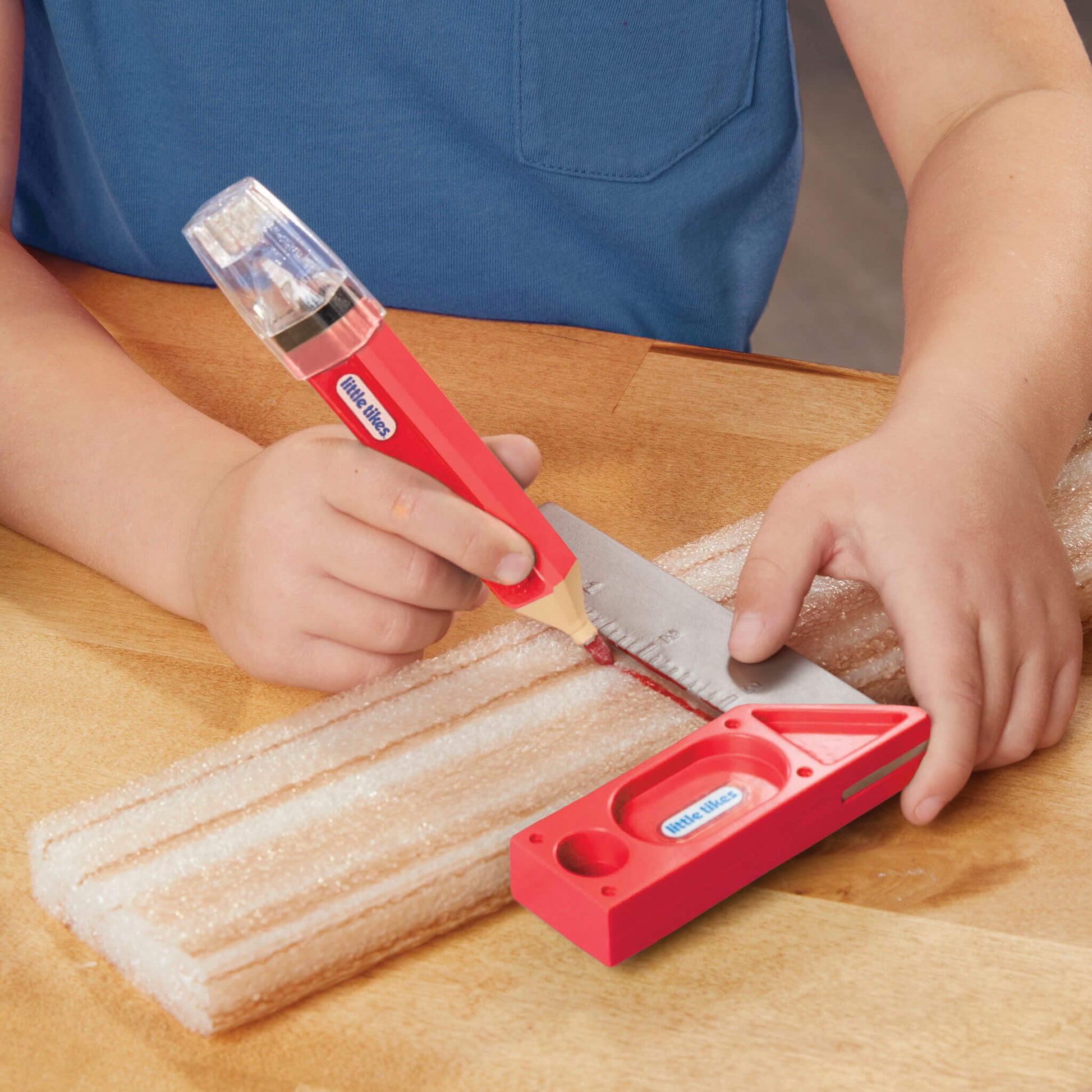 Boy using carpenter square