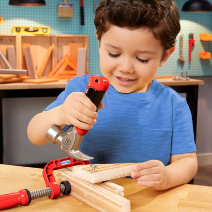 Child playing with toy hammer