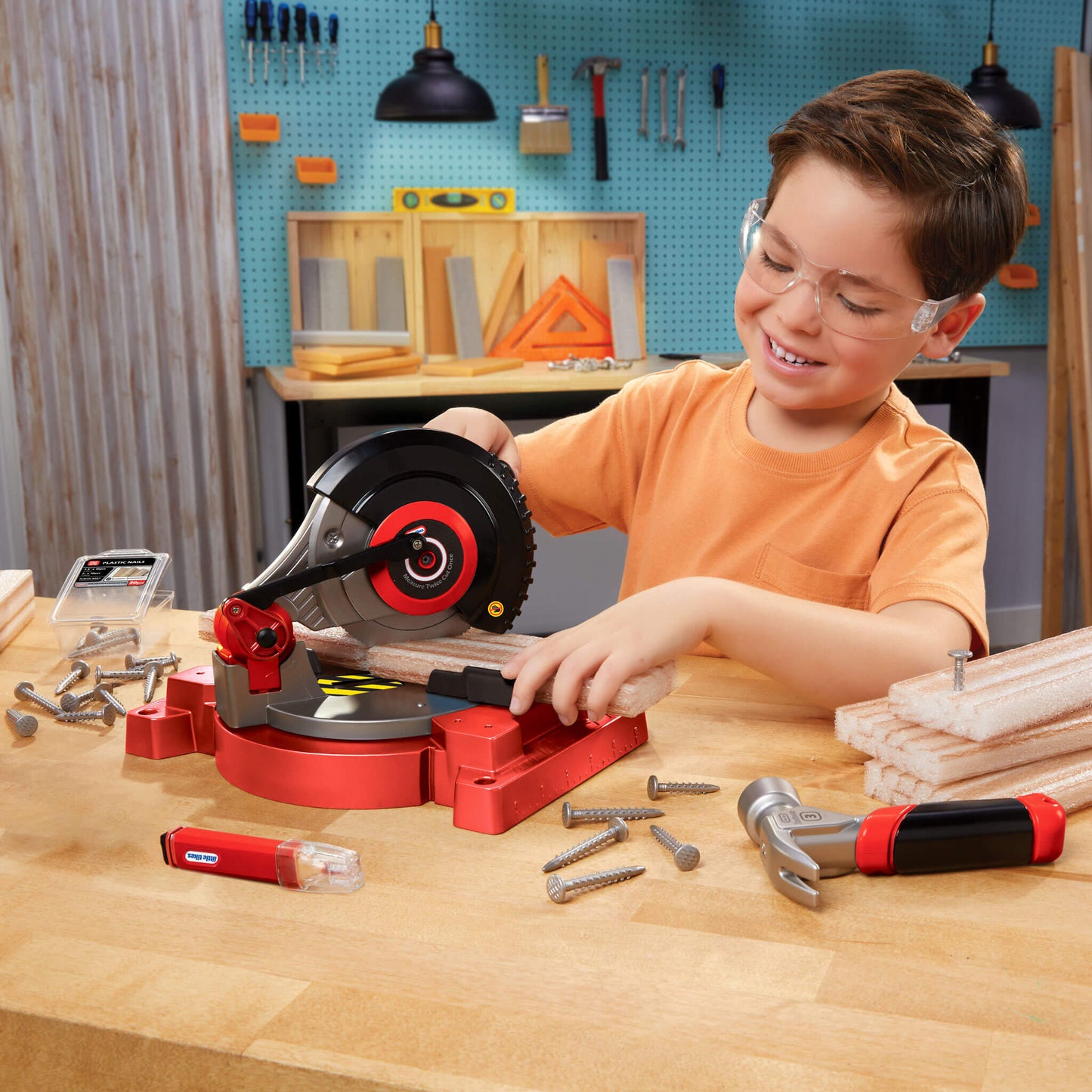 Boy using the play saw