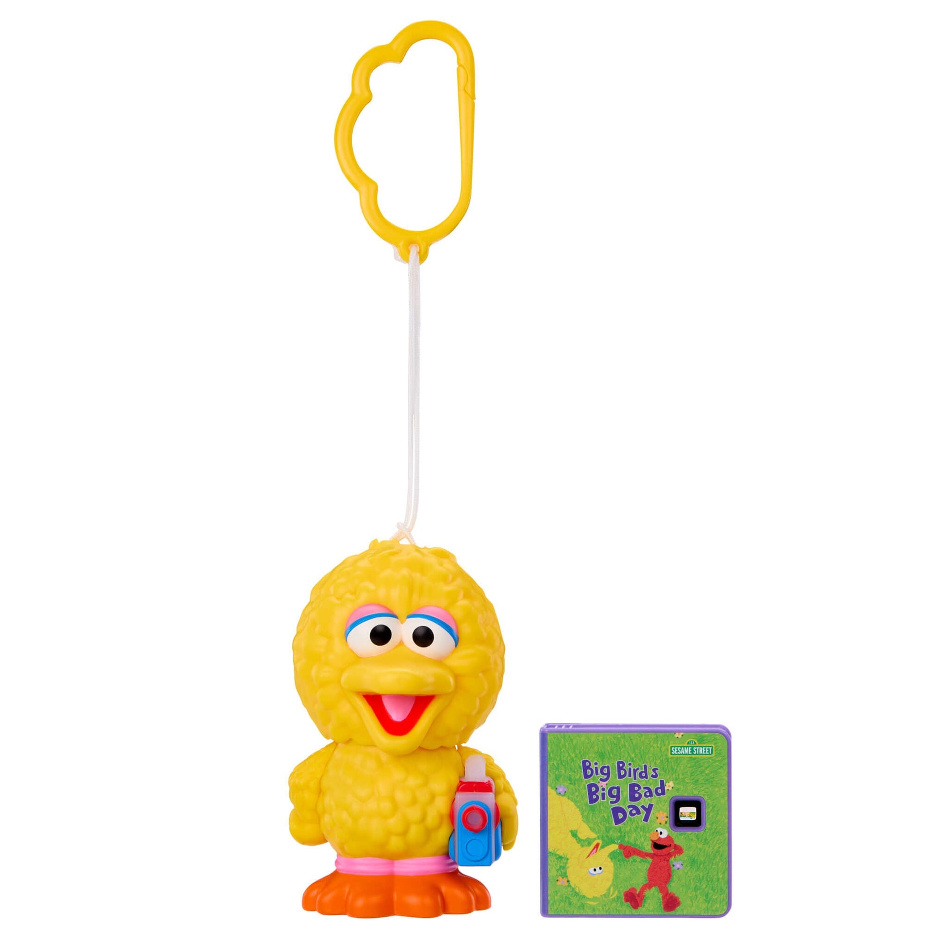 Yellow character toy with a book titled 'Big Bird's Big Bad Day' on a white background