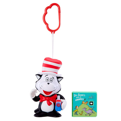 Toy figure of a cat in the hat with a book on a white background