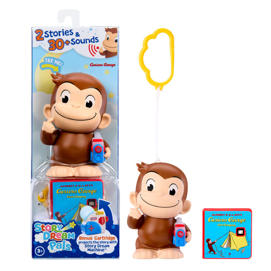 Curious George toy set including the character figure holding a Story Dream Machine, a yellow cloud-shaped keychain, and a small Story Dream Pals book on a white background.