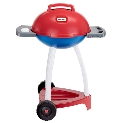 Red and blue toy barbecue grill with wheels and lid closed on a white background