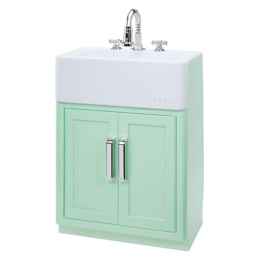 A retro toy-style sink with green base and white top with silver knobs and faucet shown on a white background