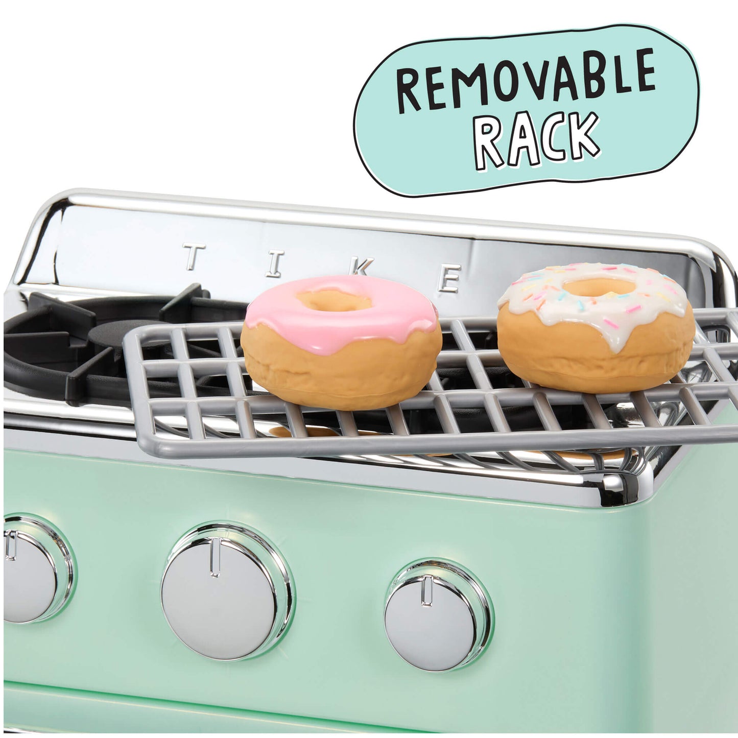 A mint green oven with a removable metal rack holding two frosted donuts, on a white background with a light blue callout bubble reading 'REMOVABLE RACK'.