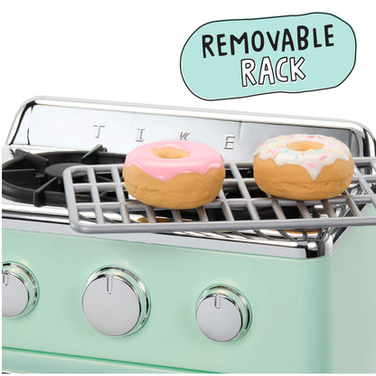 A mint green oven with a removable metal rack holding two frosted donuts, on a white background with a light blue callout bubble reading 'REMOVABLE RACK'.