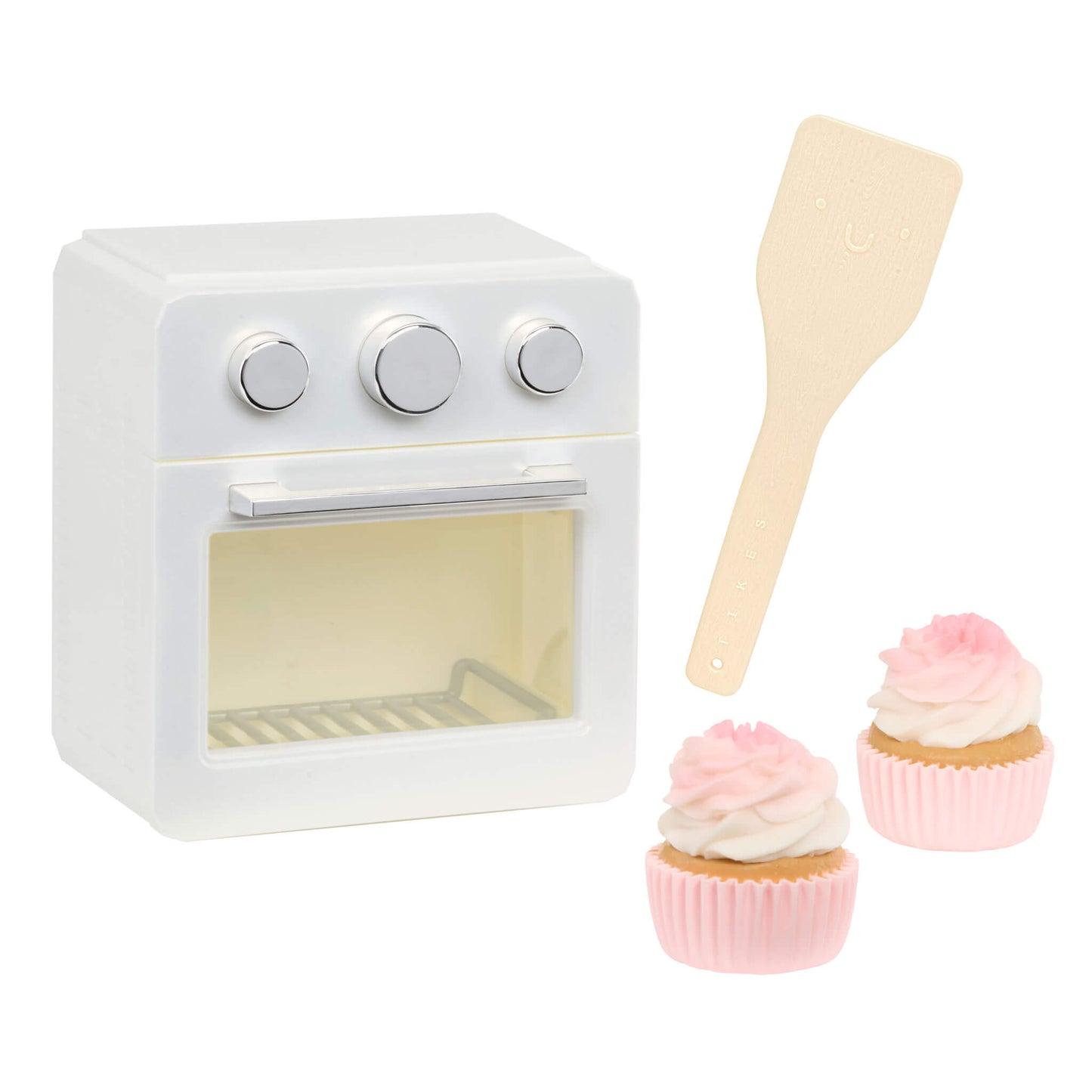 White oven, two cupcakes and a spatula on a white background