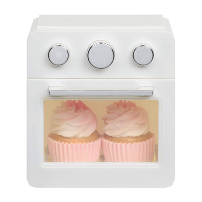 Two cupcakes inside the oven on a white background