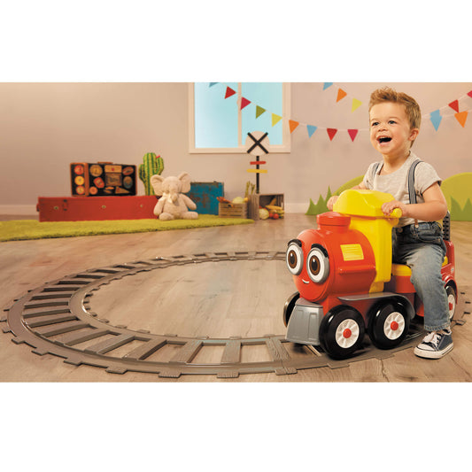Boy riding the train on the tracks