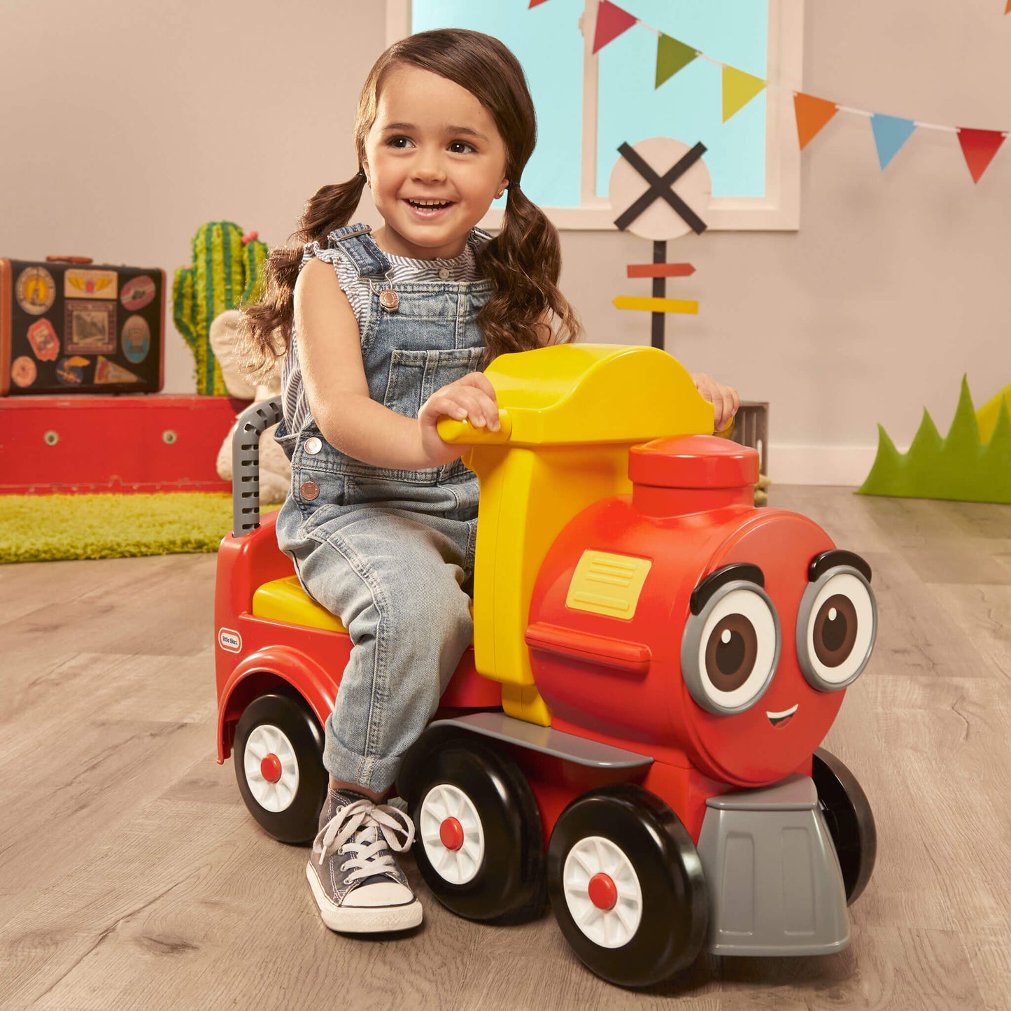 Girl riding the train on hardwood floor