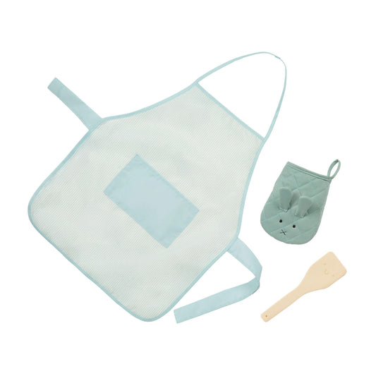 Children's apron with a matching oven mitt and wooden spatula on a white background