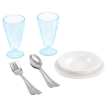 A toy tableware set featuring two light blue goblets, a stack of four white plates, and silver cutlery pieces (forks and spoons) on a solid white background.