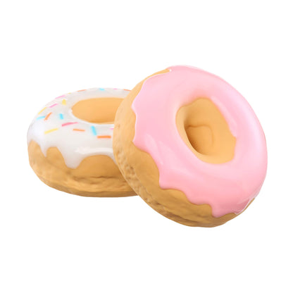 Two donut-shaped toys, one with pink icing and the other with white icing and sprinkles, on a white background.