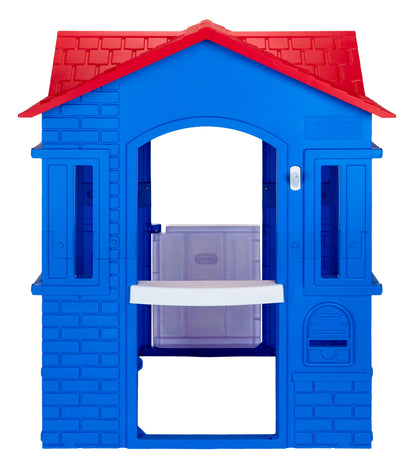 Blue plastic playhouse with a red roof on a white background