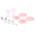 Pink plastic tableware set including plates, glasses, and cutlery on a white background