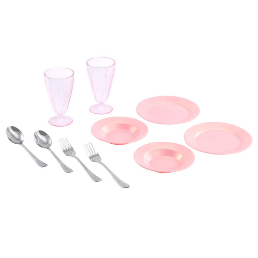 Pink plastic tableware set including plates, glasses, and cutlery on a white background