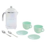 Tea set with white teapot, mint green cups and plates on a white background