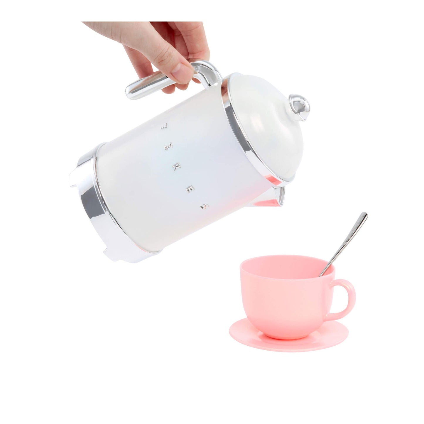 White tea pot being used with a pink cup and spoon on a white background