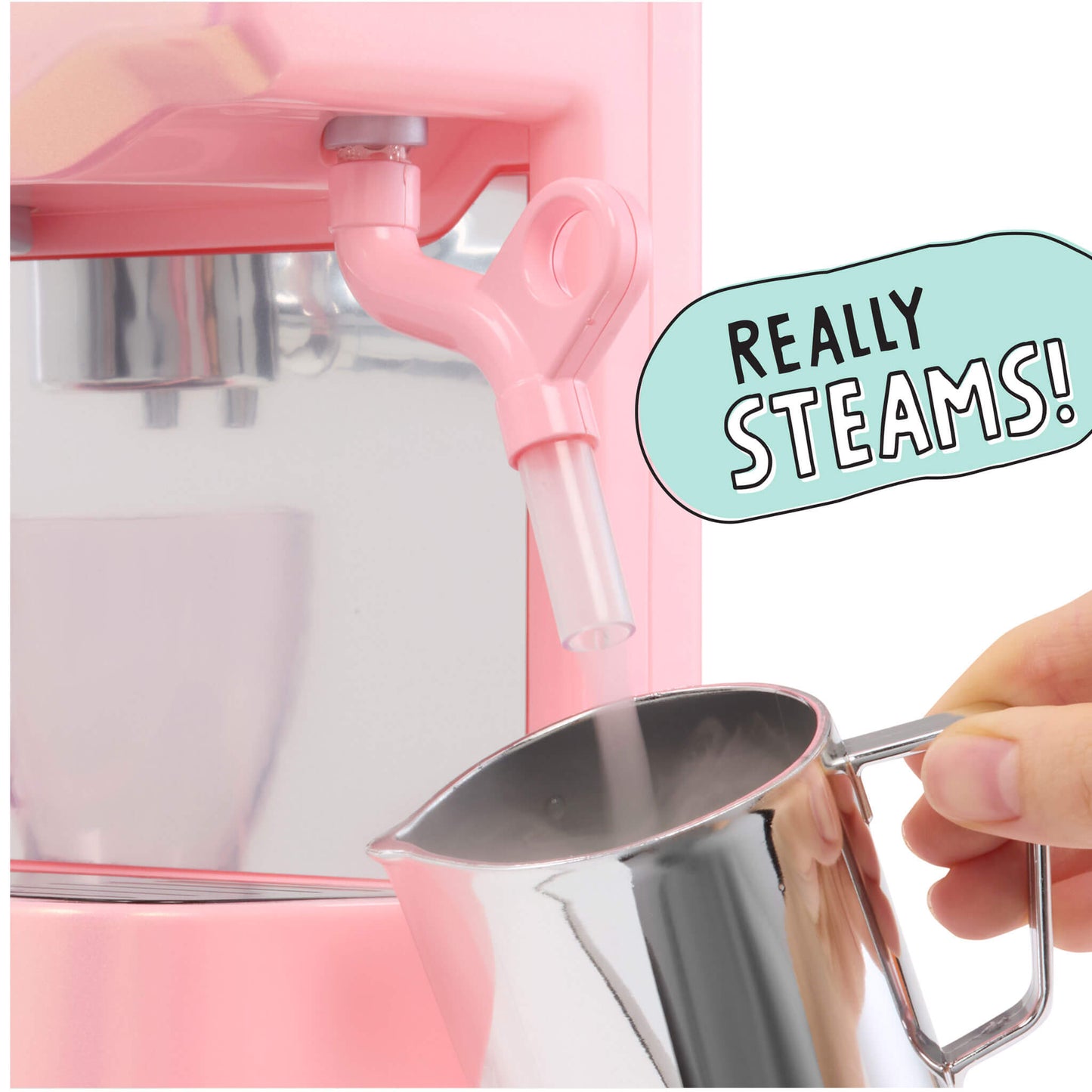 A pink espresso machine dispensing steam into a pitcher held by a hand, with a mint-green speech bubble reading 'REALLY STEAMS!' on a white background.