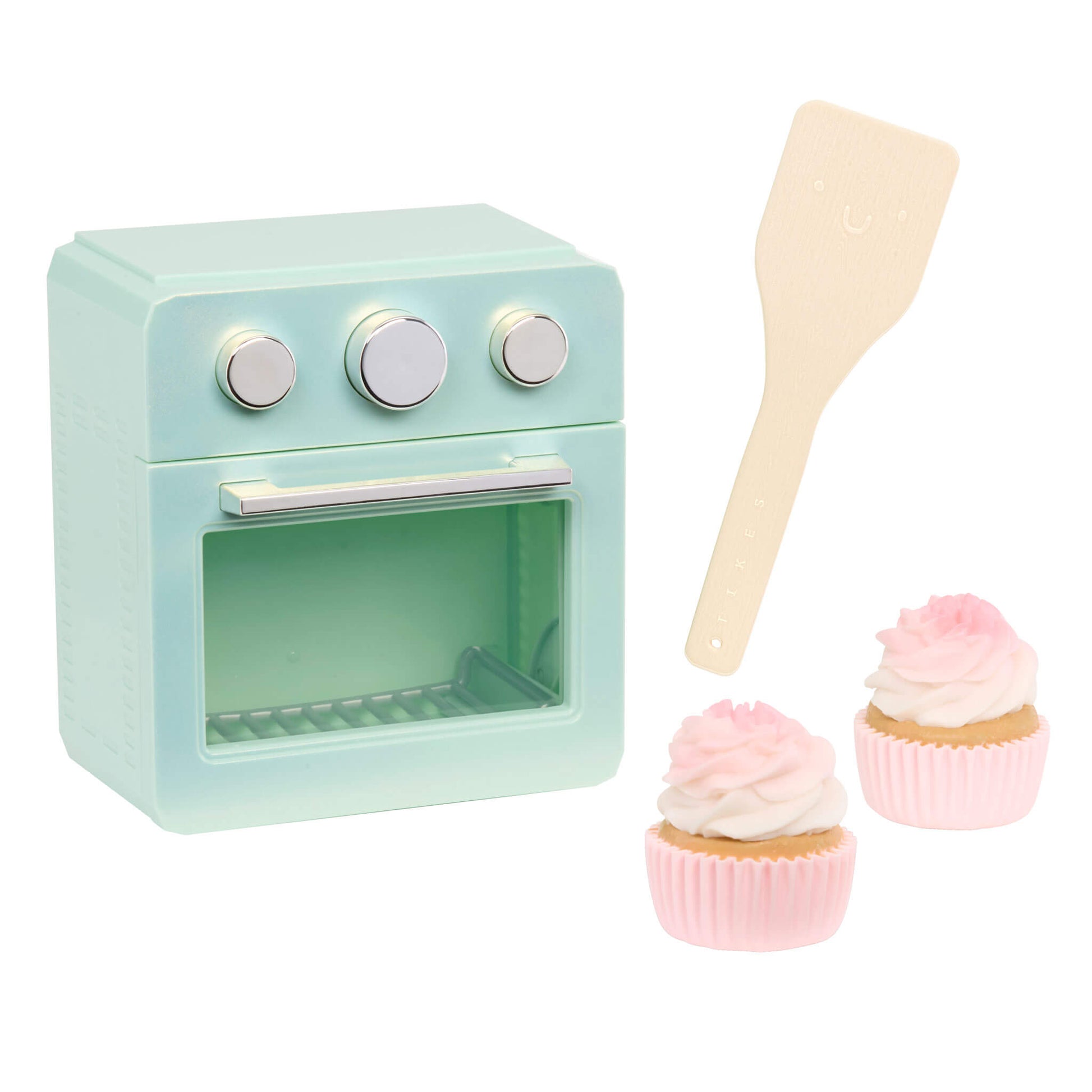 Seafoam green oven, two cupcakes and a spatula on a white background