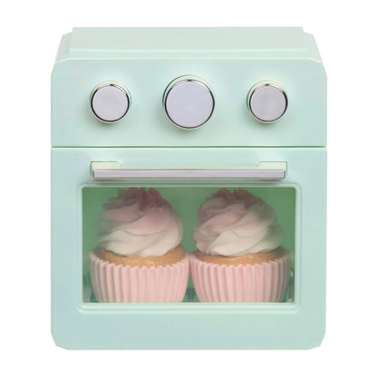 Two cupcakes inside the oven on a white background