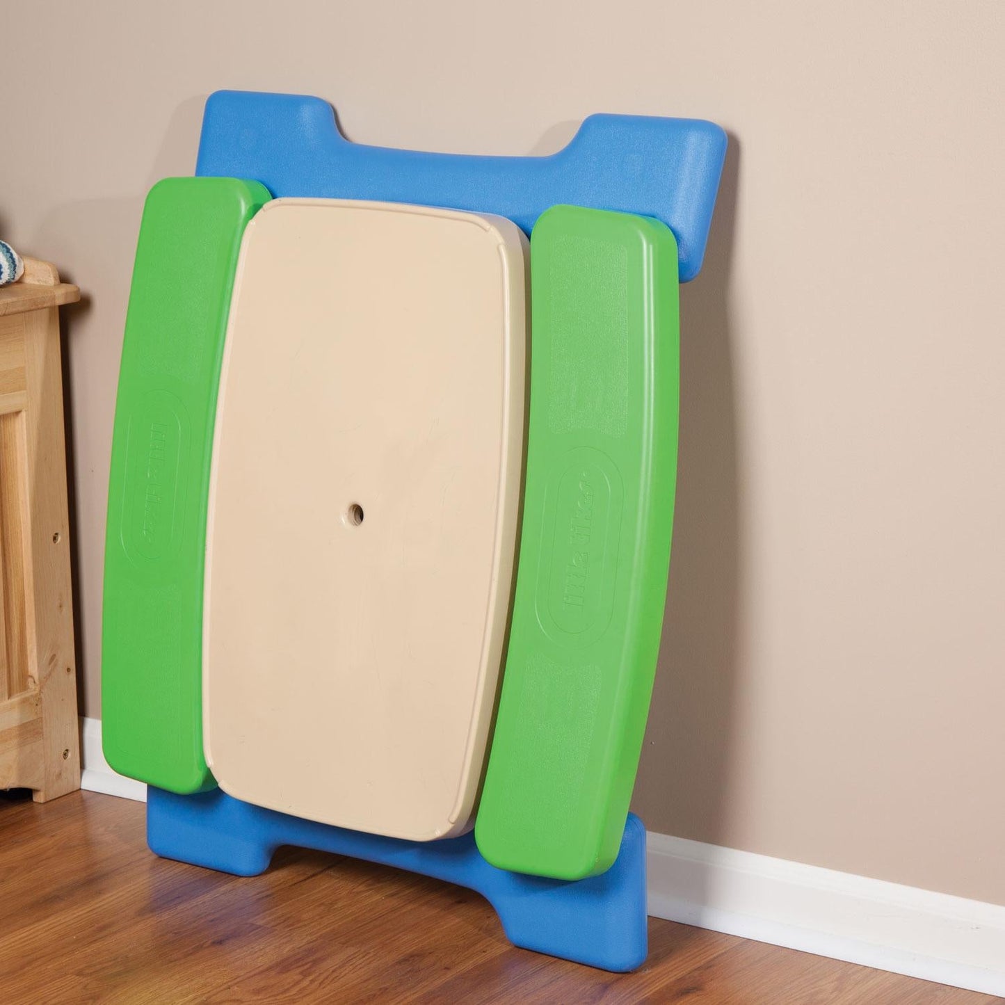 Play table unlocks and folds for portability or storage