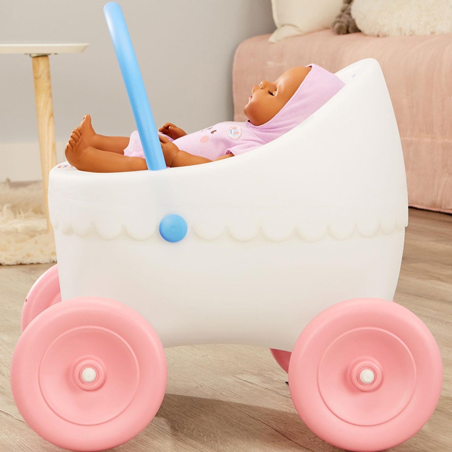 Doll buggy holds dolls up to 18
