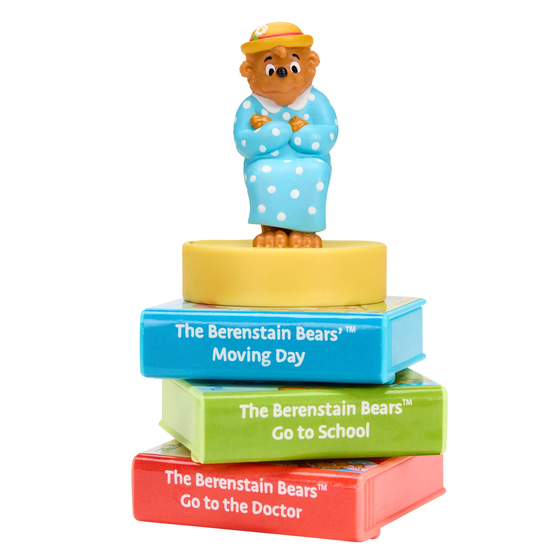 Stack of Berenstain Bears stories with Mama bear figurine on top